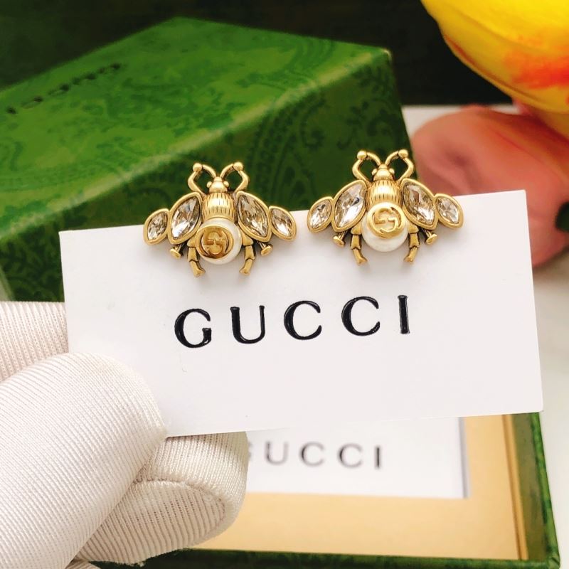 G*u*i earrings